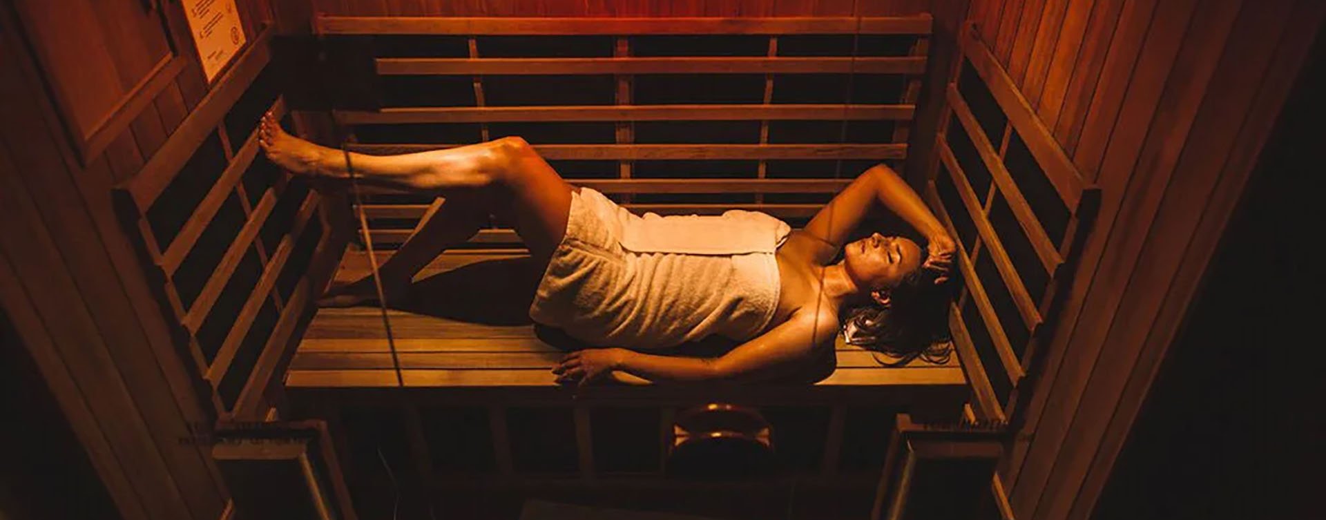 Woman relaxing in infrared sauna